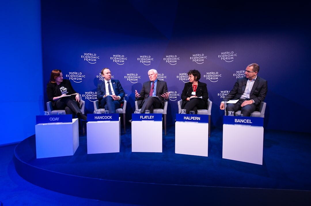 Corporate summit event with panel of executives