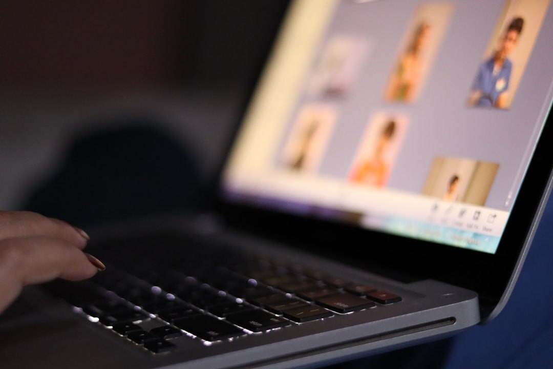 Online video conference on laptop screen with multiple participants